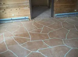 Patio slab finished in a flagstone pattern with grey grout lines